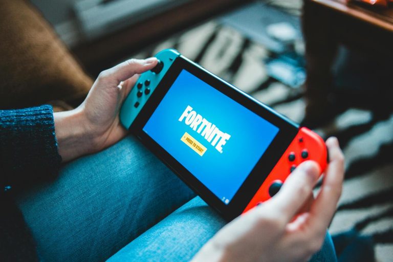 Teenage boy gaming on computer — managing Fortnite screen time as a parent